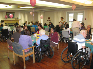 Student volunteers visit a senior's residence Intergenerational program volunteers at an event